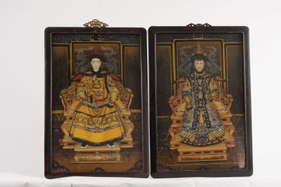 pair of asian painted wooden plaques of a woman and a man
