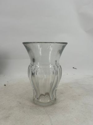 a glass vase that is sitting on a table