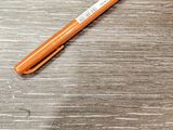 a pen that is laying on a metal table