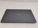 the back of a laptop with the lid open on a white surface