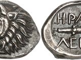 a silver coin with the head of a lion on it