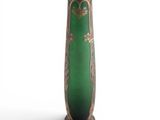 a green vase with gold decoration on it on a white background