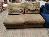 two couches that are sitting on a wooden floor