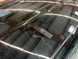 a close up of a car windshield with a remote control