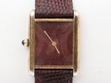 a close up of a wrist watch with a brown leather strap