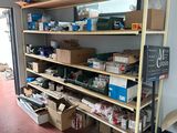 many boxes and boxes on the shelves in the room