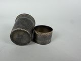 pair of antique silverplated metal cups on a white surface