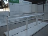 a white counter in a large room with white cabinets