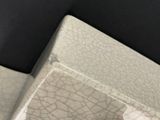 a close up of a toilet with a broken seat