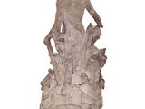 statue of a woman with a bird on her back