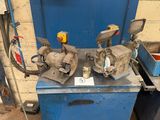 two machines that are sitting on a blue table