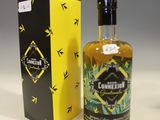 an image of a bottle of liquor next to a box