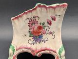 an image of a small decorative bowl with flowers on it
