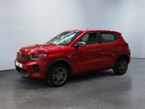 a red suv parked in a room with a white wall
