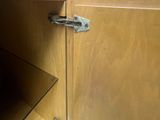 a close up of a wooden cabinet with a latch on it