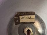 a close up of a metal object with a label on it