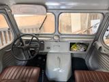 a view of the inside of a vehicle with the driver ' s seat up