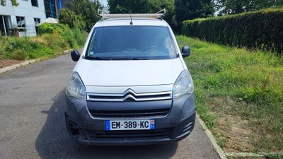 a small white van parked on the side of the road