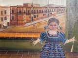 tableau représentant une petite fille en robe bleue tenant un balai
