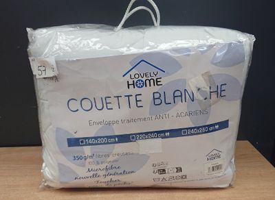 a pillow that is wrapped in plastic on a table