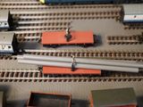 many different types of trains on the train tracks