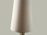 a lamp that has a white shade on it