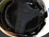 a close up of a helmet with a strap on it