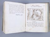 an open book with a drawing of a man and a woman on it