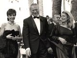 black and white photograph of a group of people dressed in formal attire