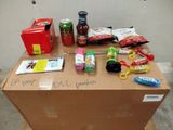 a cardboard box with a bunch of items on top of it