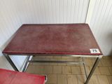 a table with a red cloth on it in a room