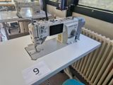 a sewing machine sitting on a table in a room