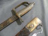 two different types of knives on display on a table