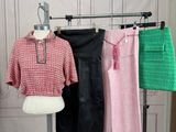 a mannequin in front of a display of clothes