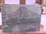 a painting of a cityscape on a wooden easel