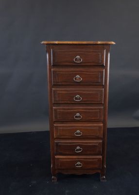 a wooden chest of drawers with five drawers on each side
