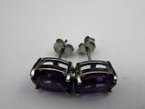 an image of a pair of amethorate earrings on a white surface
