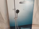 the box of the shower is open on the bed