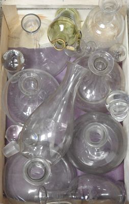 many empty glass bottles in a box on the floor