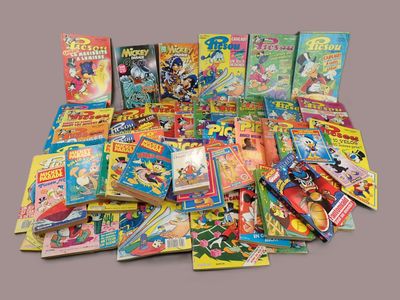 a lot of comics and books on the table