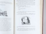 an open book with a drawing of a horse pulling a carriage