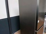 an image of a black refrigerator in a room