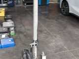 an image of a car in a garage being worked on