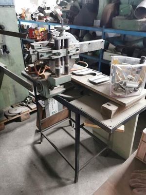 a picture of a workbench in a workshop with a lot of tools on it