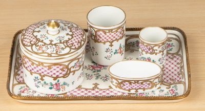 a tray with a tea set on it on a table