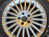 a close up of a tire with a tire chain attached to it