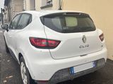 a white car parked on the side of the street