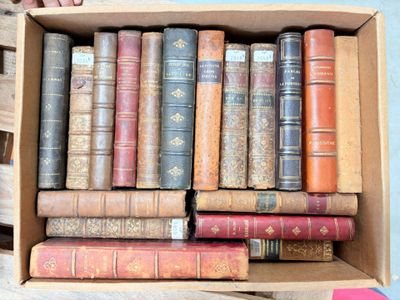 a box full of old books sitting on a table