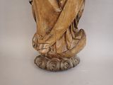 a statue of a woman holding a baby in her arms