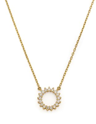 a gold plated necklace with a white diamond flower pendant